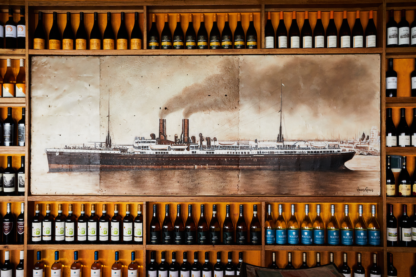 Blue Restaurant dining room with its waterfront boat mural